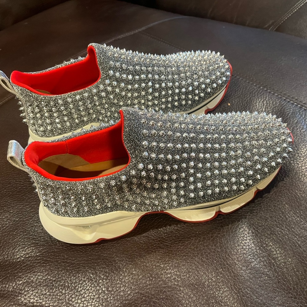 Christian Louboutin Silver Spiked Sneakers with Red Accents